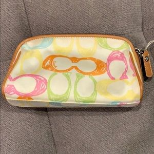Small fabric Coach makeup bag